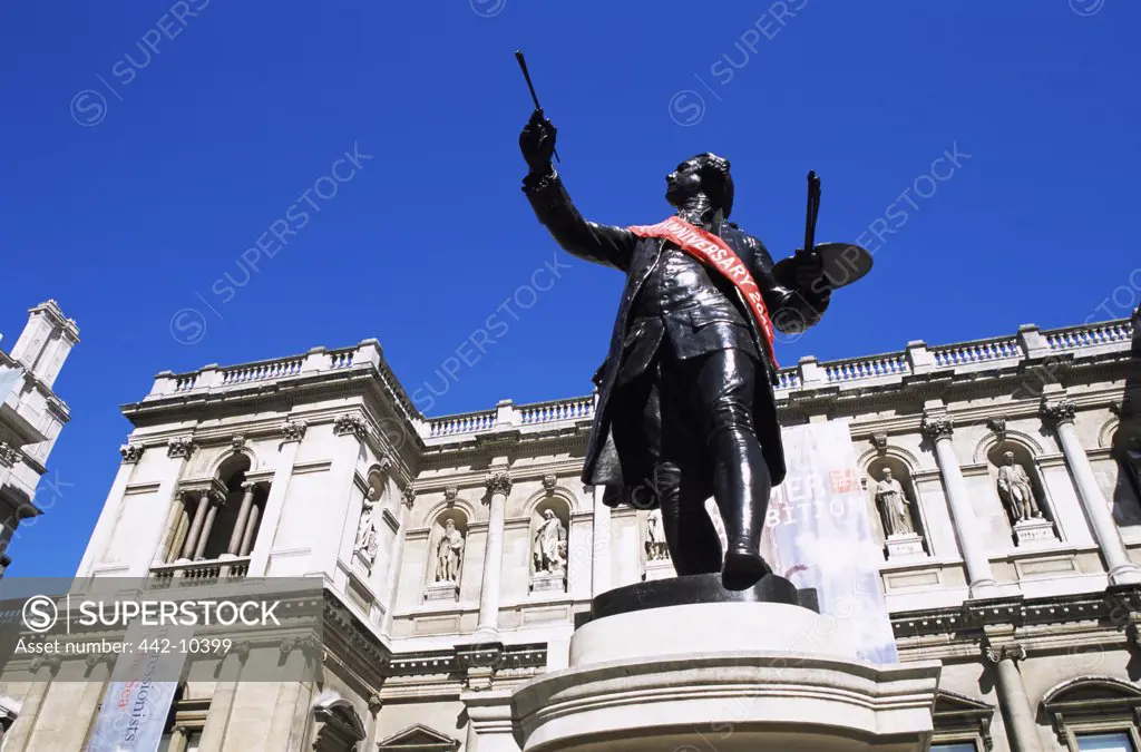 Low angle view of a statue, Sir Joshua Reynolds by Alfred Drury, Royal Academy of Arts, Piccadilly, London, England