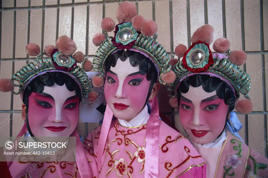Portrait of three female Chinese opera performers, Hong Kong, China