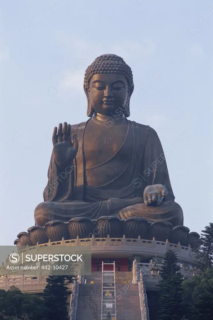 Low angle view of a statue of Buddha, Tian Tan Buddha, Po Lin Monastery, Ngong Ping, Lantau, Hong Kong, China