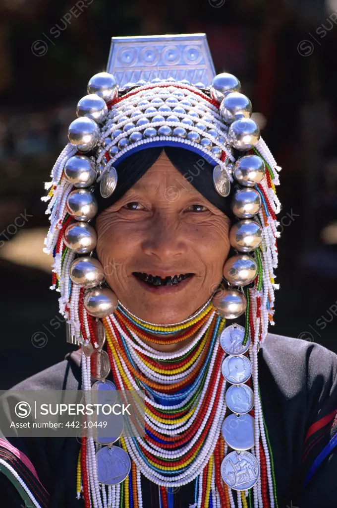 Portrait of an Akha tribal woman wearing traditional silver jewelry, Chiang Rai, Chiang Rai Province, Thailand