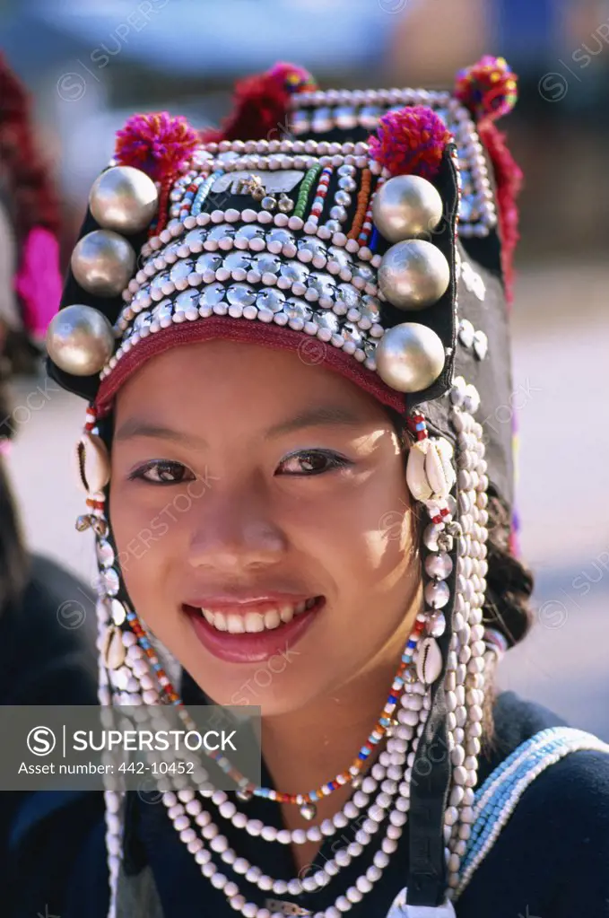 Portrait of an Akha tribal woman wearing a traditional silver headpiece, Chiang Rai, Chiang Rai Province, Thailand