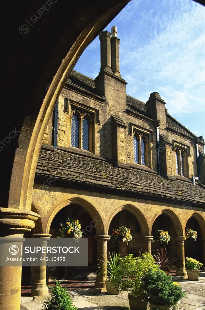 Almshouse viewed from an arch, St. John's Almshouse, Sherborne, Somerset, Dorset, England