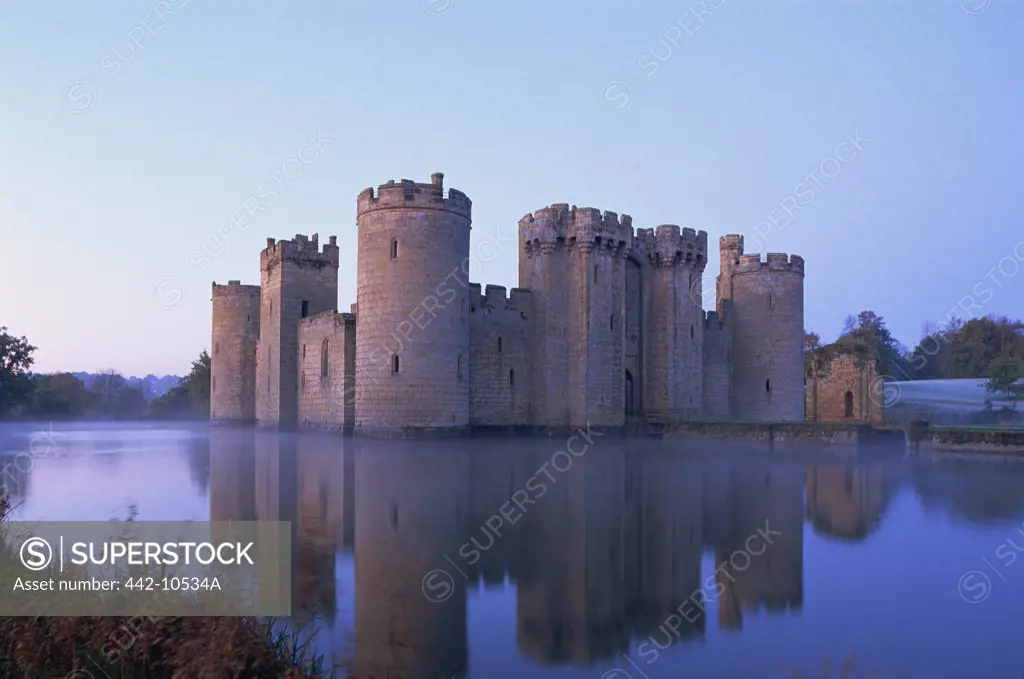 Reflection of a castle in water, Bodiam Castle, East Sussex, England