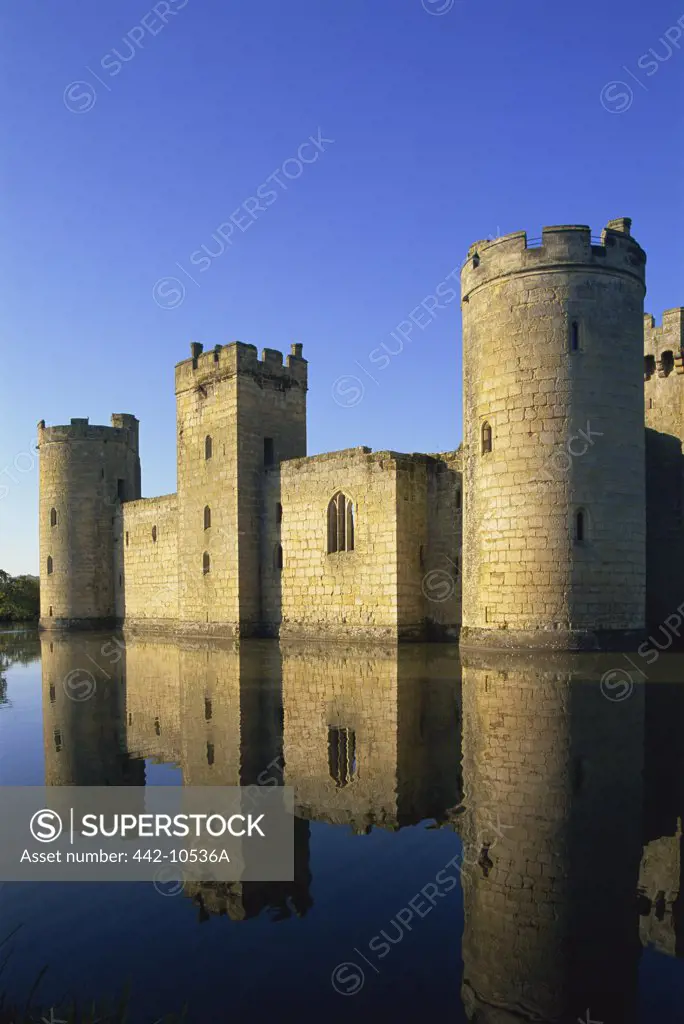 Reflection of a castle in water, Bodiam Castle, East Sussex, England