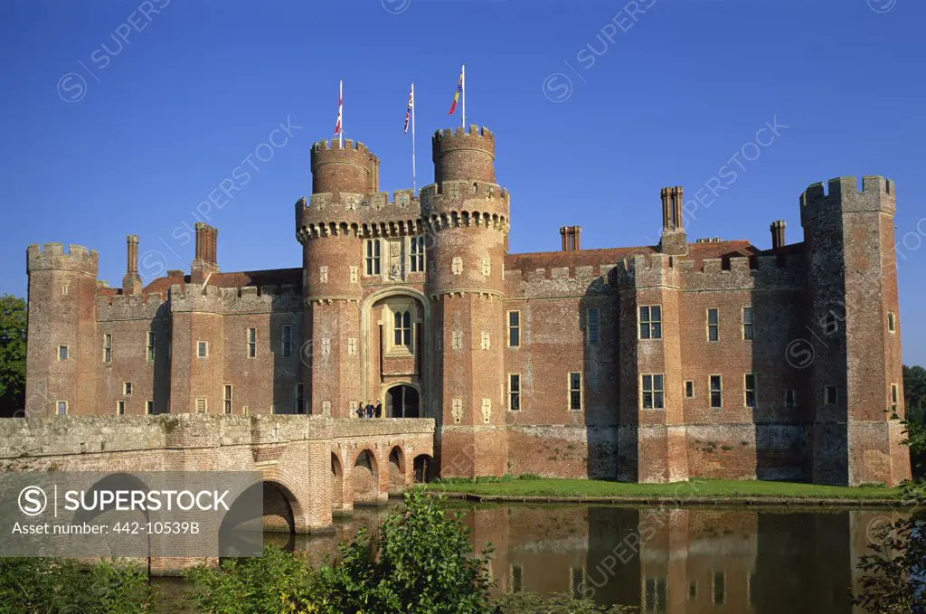 Reflection of a castle in water, Herstmonceux Castle, East Sussex, England