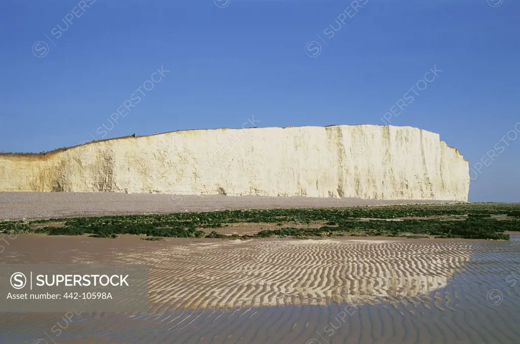Reflection of a cliff in water, Seven Sisters, Beachy Head, Eastbourne, East Sussex, England