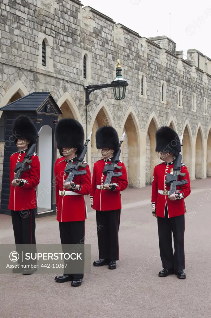 Guards standing in front of a castle, Windsor Castle, Windsor and Eton, Berkshire, England