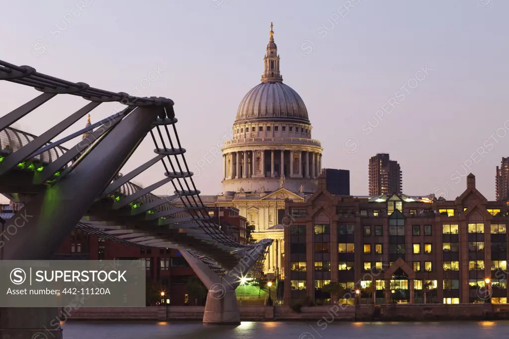 Bridge across a river with a cathedral in the background, London Millennium Footbridge, St. Paul's Cathedral, City Of London, Thames River, London, England