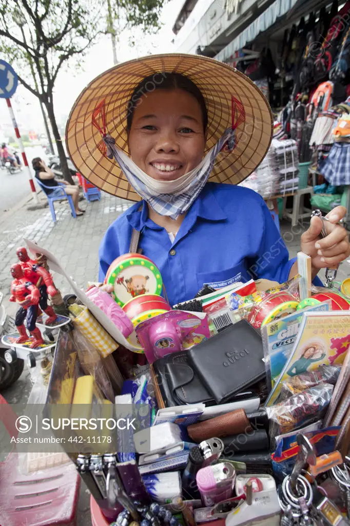 Female street vendor smiling, Ho Chi Minh City, Vietnam