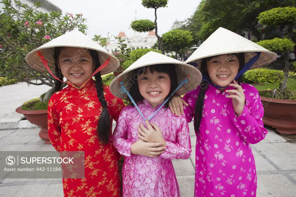 Girls standing in a park, Ho Chi Minh City, Vietnam