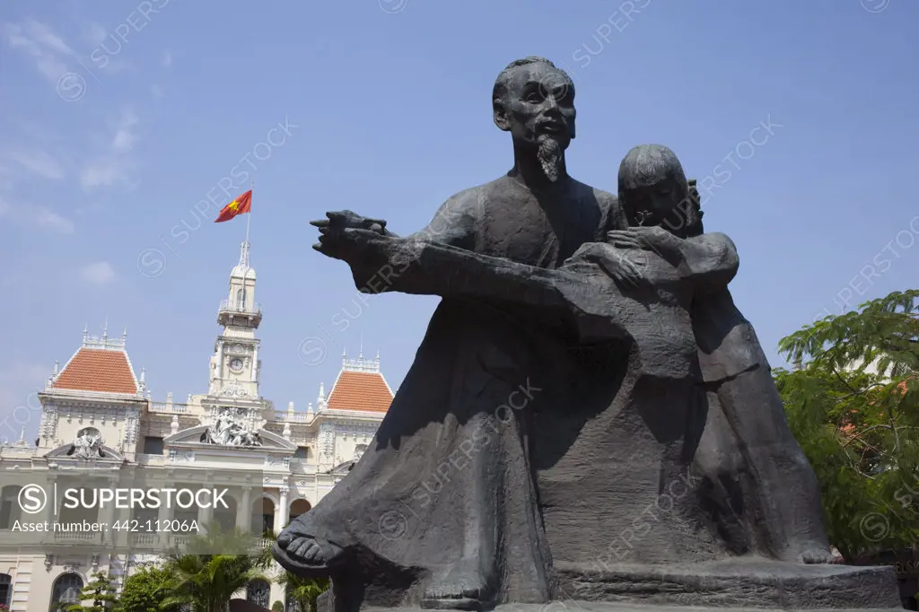 Statue of Ho Chi Minh the Vietnamese communist statesman in front of a city hall, Ho Chi Minh City, Vietnam