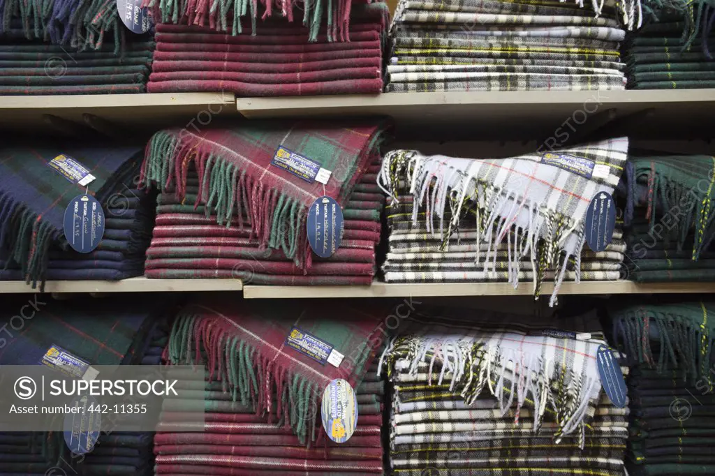 Tartan fabric in shelves in a mill, Tartan Weaving Mill, Edinburgh, Scotland