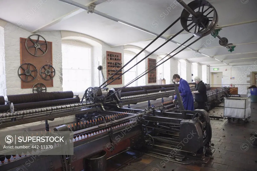 Workers working in a textile factory, New Lanark, Lanark, Scotland