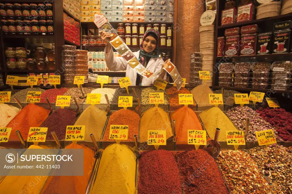 Young woman selling spices, Sultanahmet, Istanbul, Turkey