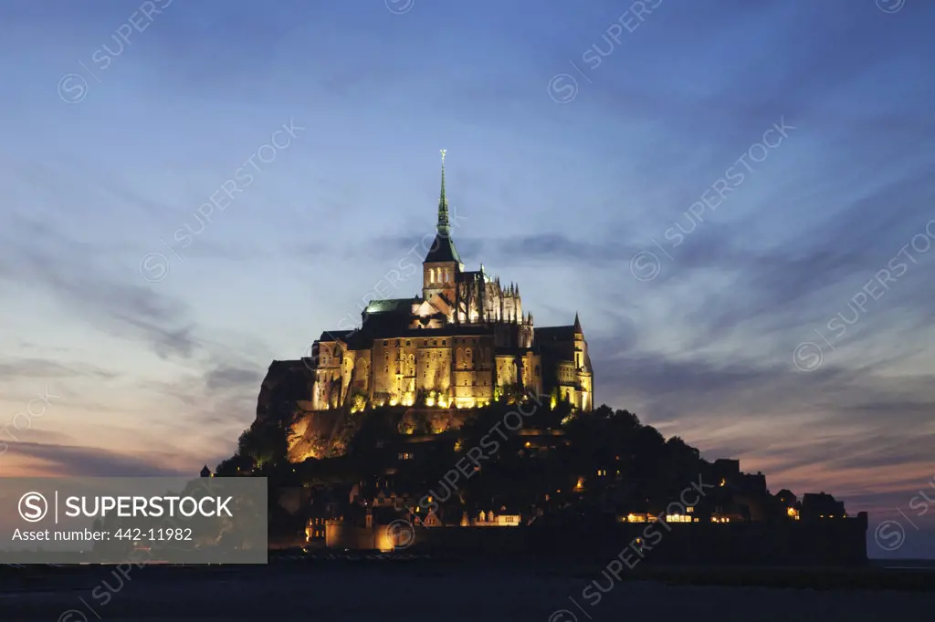 Cathedral lit up at dusk, Mont Saint-Michel, Normandy, France