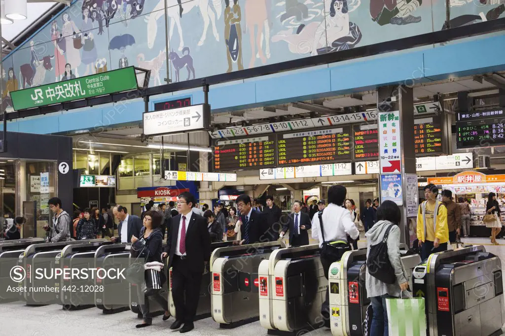 Passengers walking through turnstile, Ueno Station, Ueno, Tokyo Prefecture, Japan