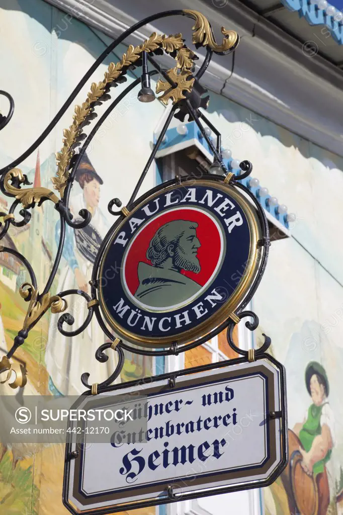 Low angle view of pub signs, Munich, Bavaria, Germany