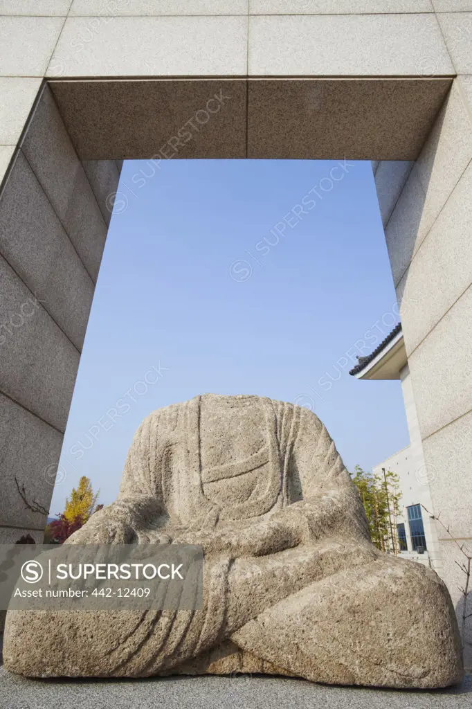 Headless stone statue of Buddha in a museum, Gyeongju National Museum, Gyeongju, South Korea
