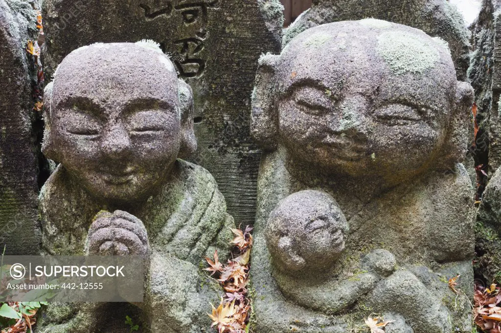 Statue in the garden of a temple, Otagi Nenbutsu ji Temple, Arashiyama, Kyoto Prefecture, Kinki Region, Honshu, Japan