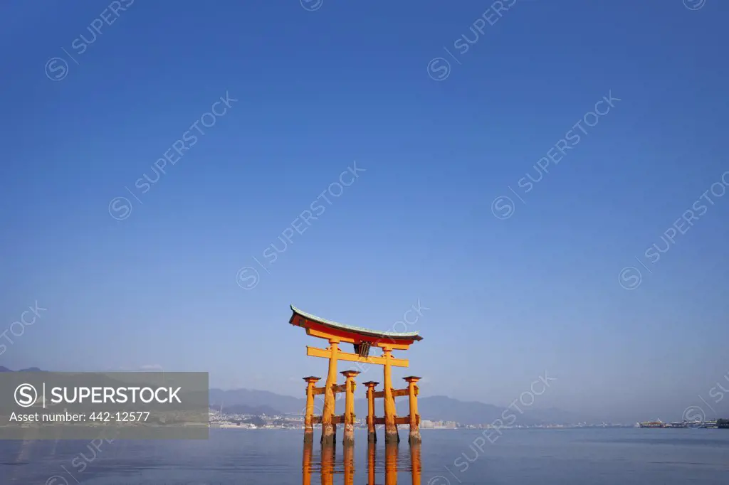 Reflection of Torii gate in water, Itsukushima Shrine, Miyajima, Itsukushima, Hiroshima Prefecture, Chugoku Region, Honshu, Japan