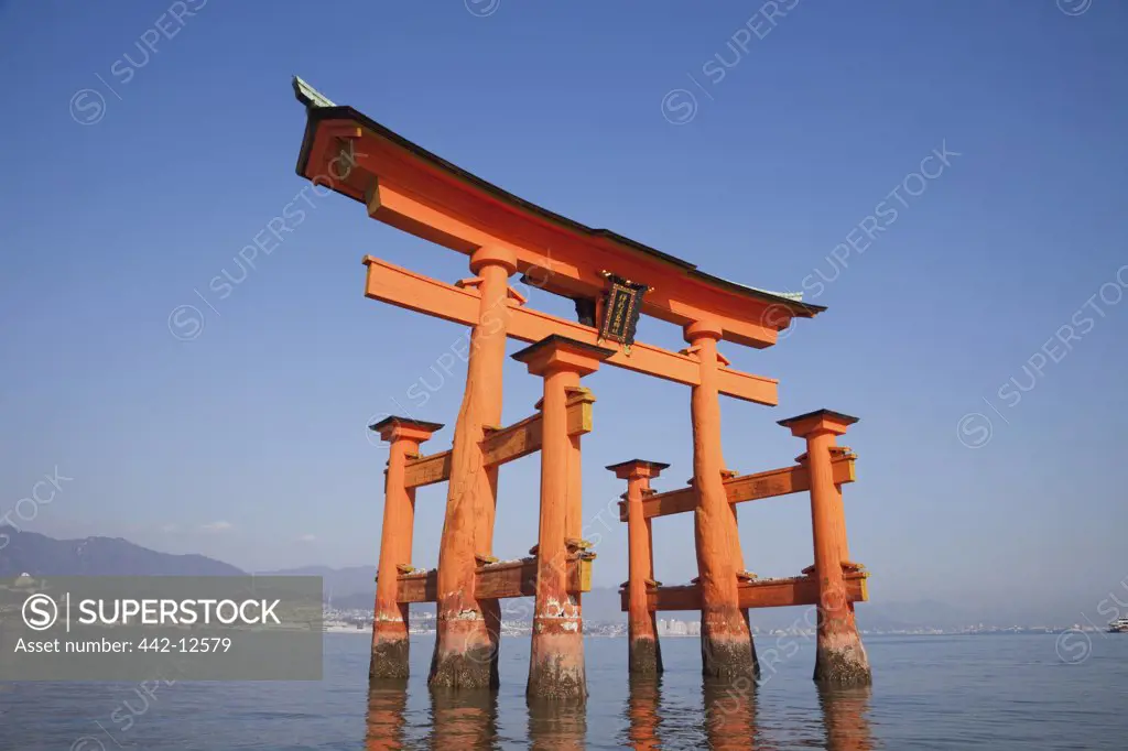 Reflection of Torii gate in water, Itsukushima Shrine, Miyajima, Itsukushima, Hiroshima Prefecture, Chugoku Region, Honshu, Japan