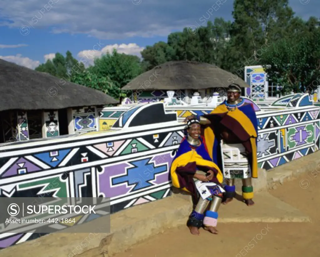Two mid adult women wearing costumes, Ndebele Village, Transvaal, South Africa