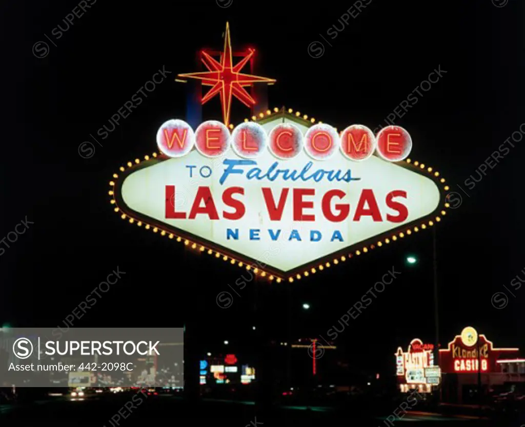 Low angle view of a welcome sign lit up at night, Las Vegas, Nevada, USA