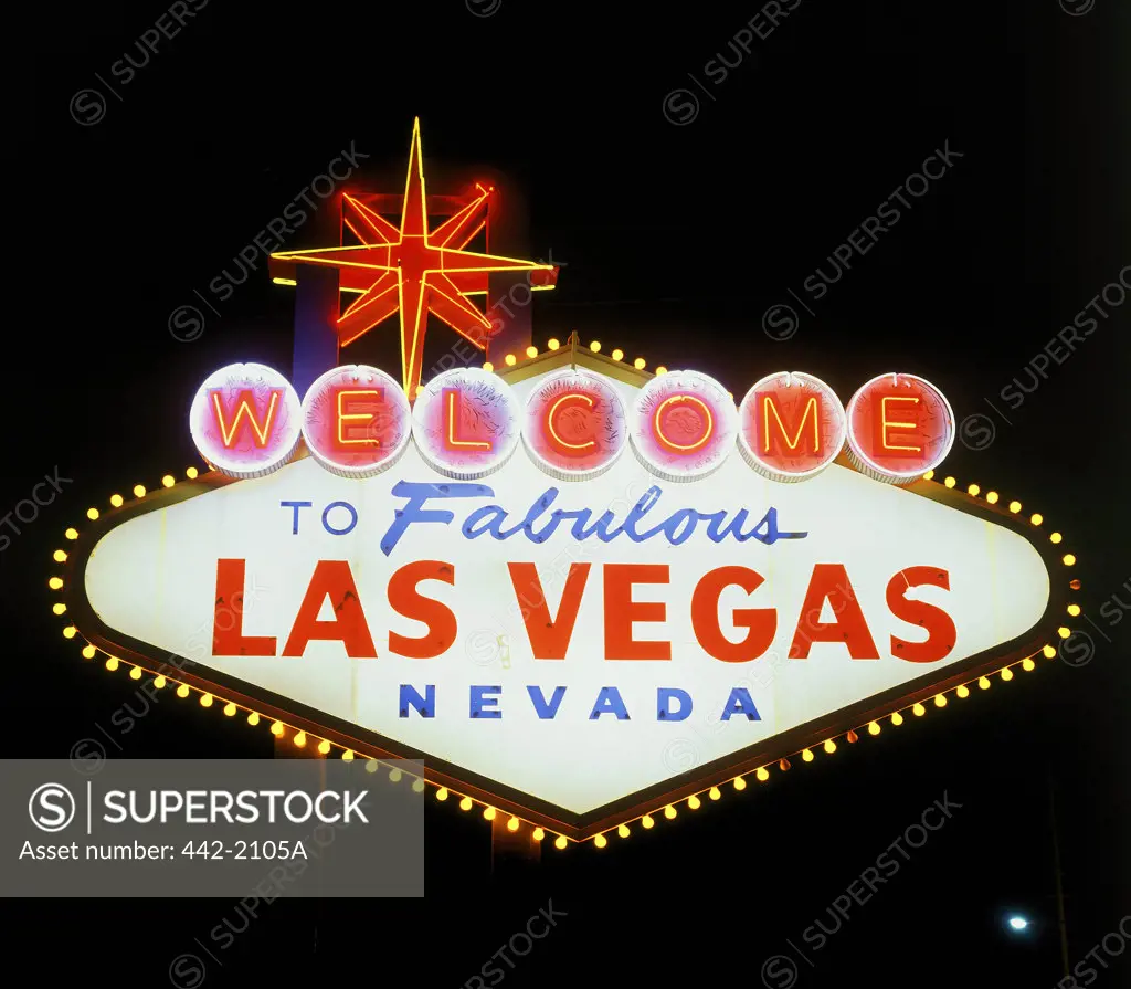Low angle view of a welcome sign lit up at night, Las Vegas, Nevada, USA