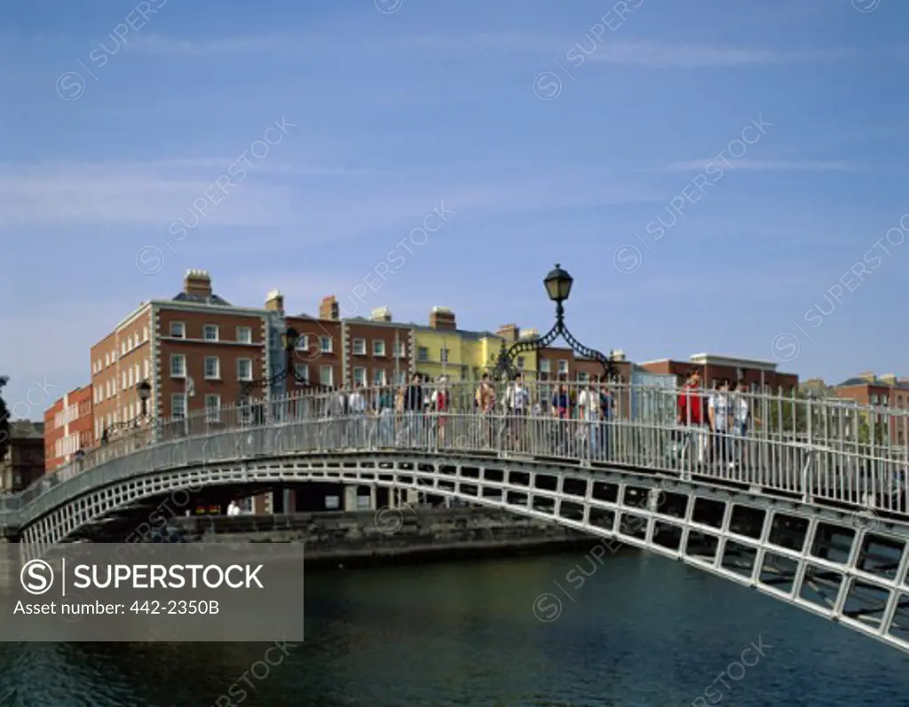 Tourists walking on a bridge, Halfpenny Bridge, Dublin, Ireland
