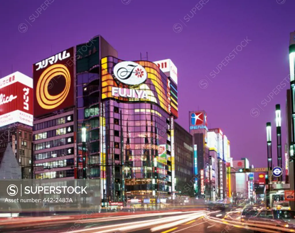 Shopping malls and stores lit up at night, Ginza, Tokyo, Japan