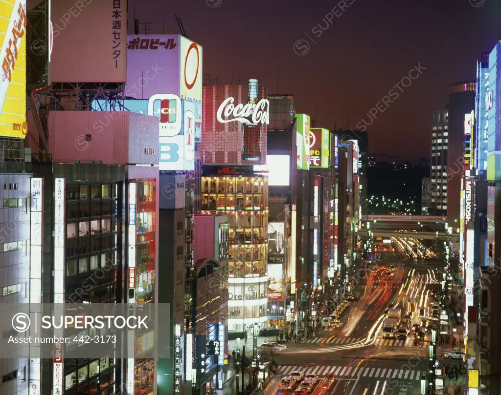 Commercial buildings lit up at night, Shinjuku Ward, Tokyo, Japan