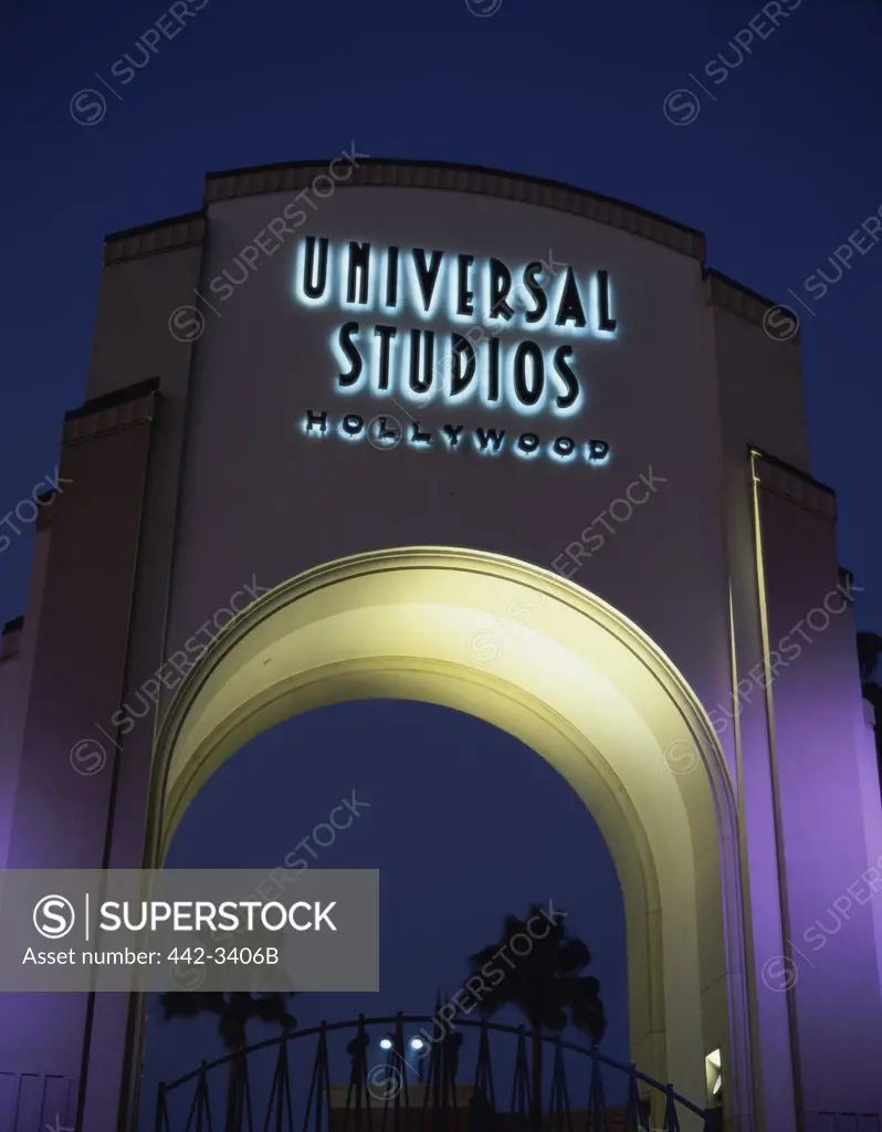 Low angle view of a gate lit up at night, Universal Studios Hollywood, Los Angeles, California, USA