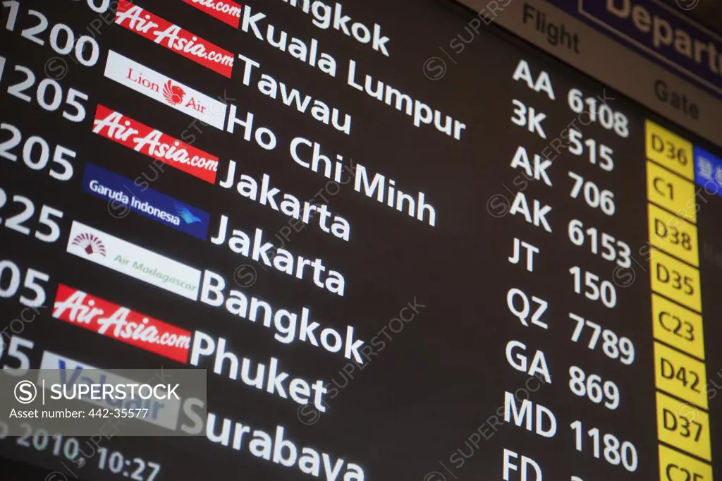 Low angle view of an arrival departure board at an airport, Changi International Airport, Singapore