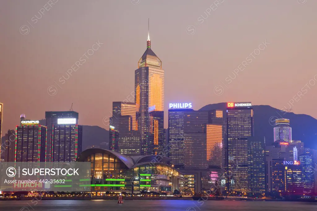 Buildings lit up at sunset, Wanchai, Hong Kong, China