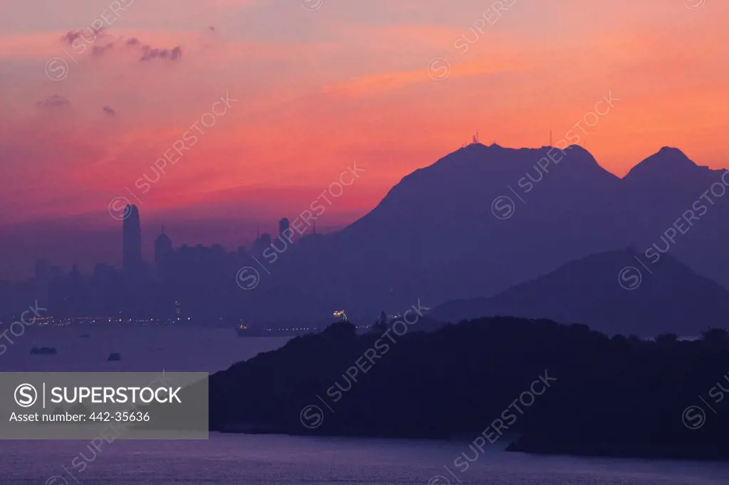 City with mountains at dawn, Hong Kong, China