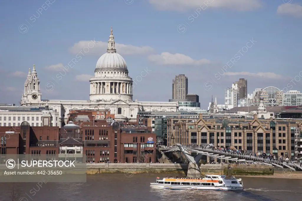 Bridge across a river with cathedral in the background, Millennium Bridge, Thames River, St. Paul's Cathedral, London, England
