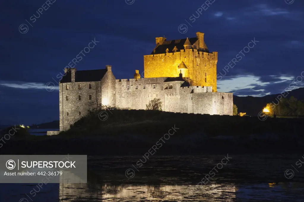 Castle lit up at night, Eilean Donan Castle, Loch Duich, Highlands Region, Scotland