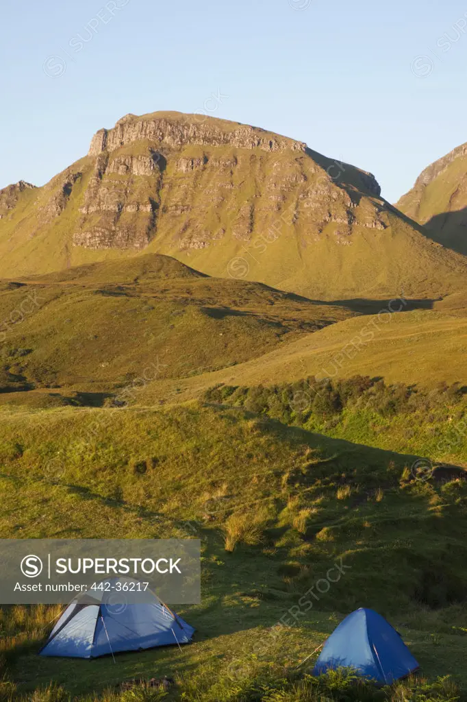 Camping tents with mountains in the background, Quiraing Mountain Range, Isle of Skye, Inner Hebrides, Scotland