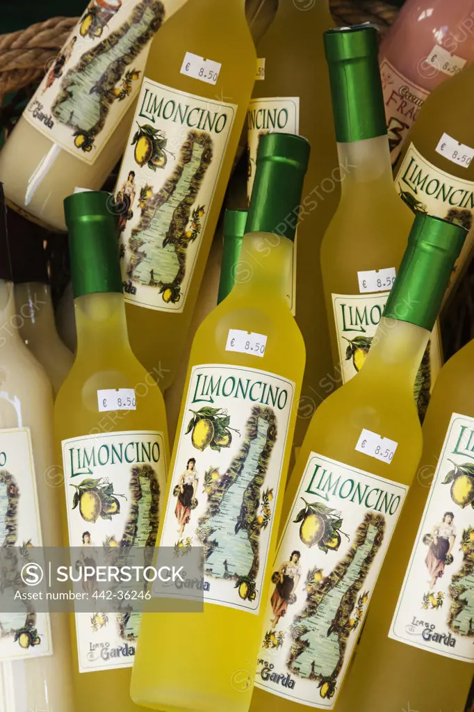 Liquor store display of Limoncino bottles, Riva del Garda, Lake Garda, Trento, Italy
