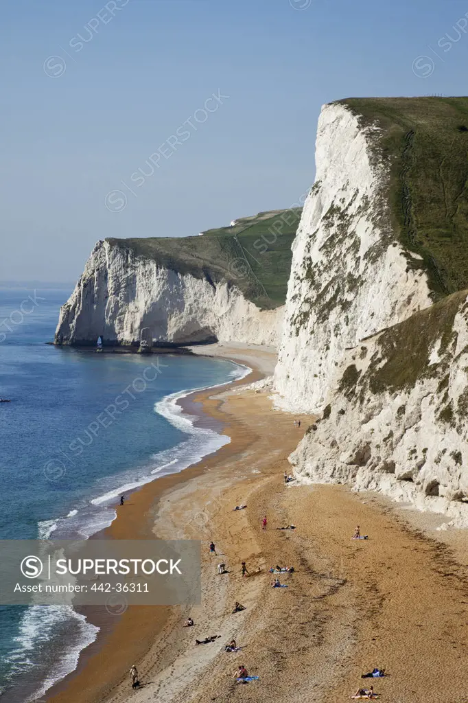 High angle view of tourists on the beach, Durdle Door Beach, Jurassic Coast, Dorset, England