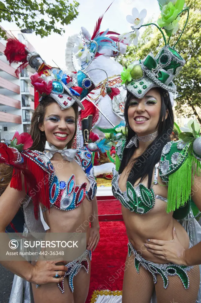 Two female performers during the Notting Hill Carnival, Notting Hill, London, England