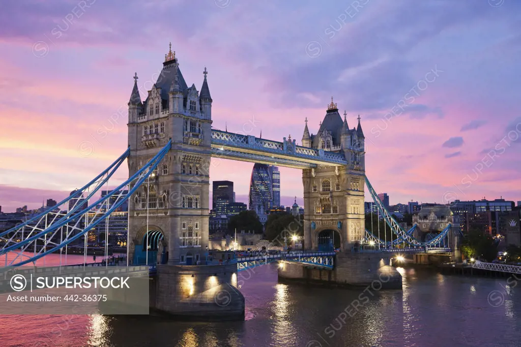 Bridge across a river at dusk, Tower Bridge, Thames River, London, England
