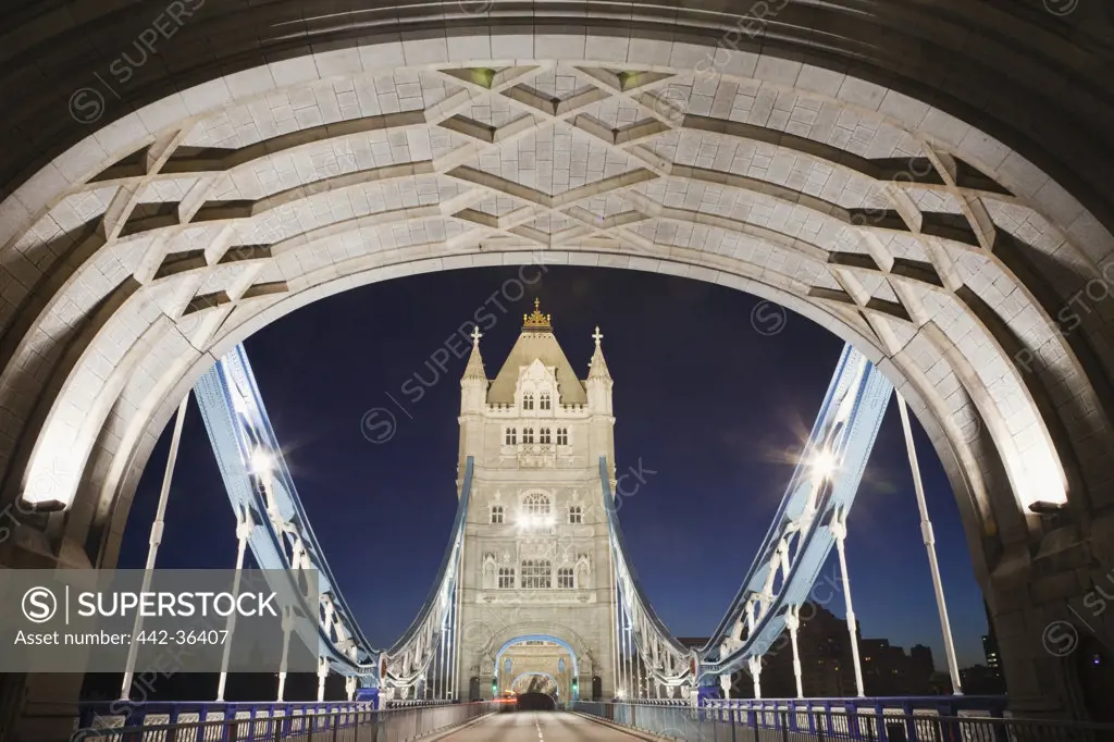 Tower Bridge lit up at night, Thames River, London, England