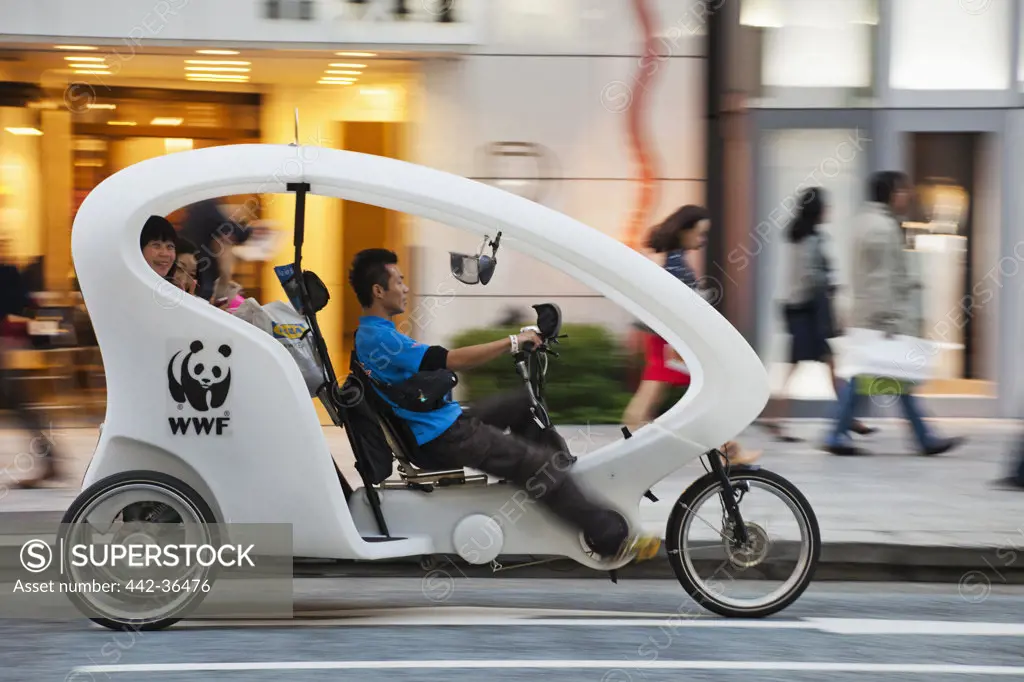 Pedicab taxi on the road, Ginza, Tokyo, Japan