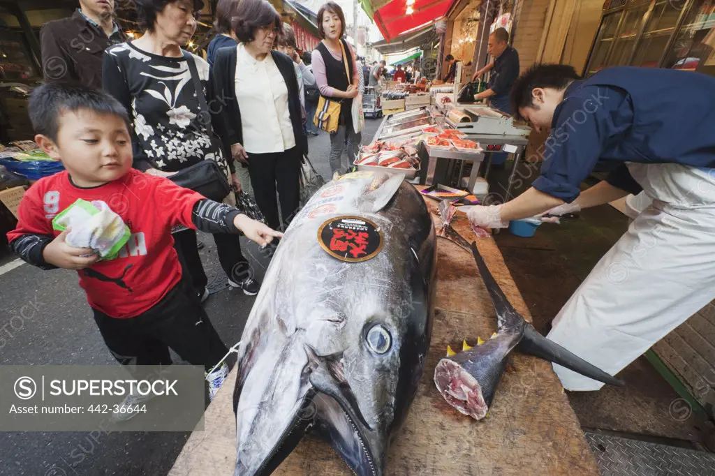 Customers at a fish market, Tsukiji Fish Market, Tokyo, Japan