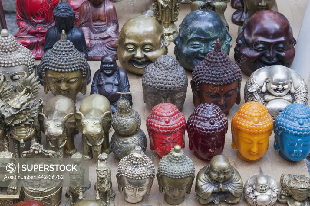 Antique store display of Buddha heads, Cat Street, Hollywood Road, Hong Kong, China
