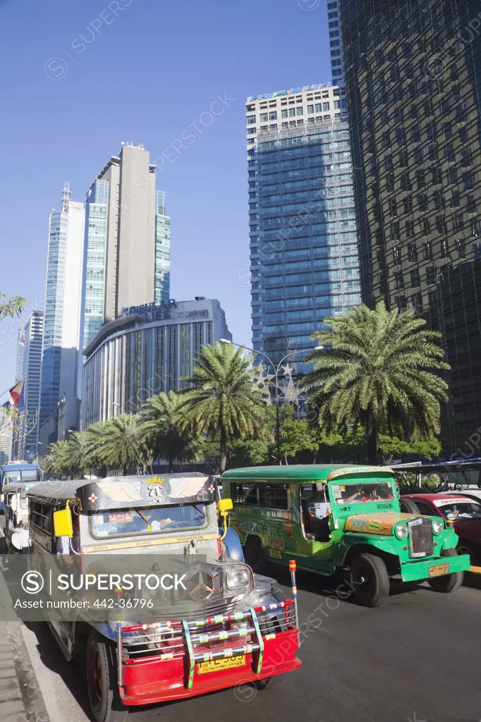 Jeepneys on a street, Ayala Avenue, Makati, Manila, Philippines