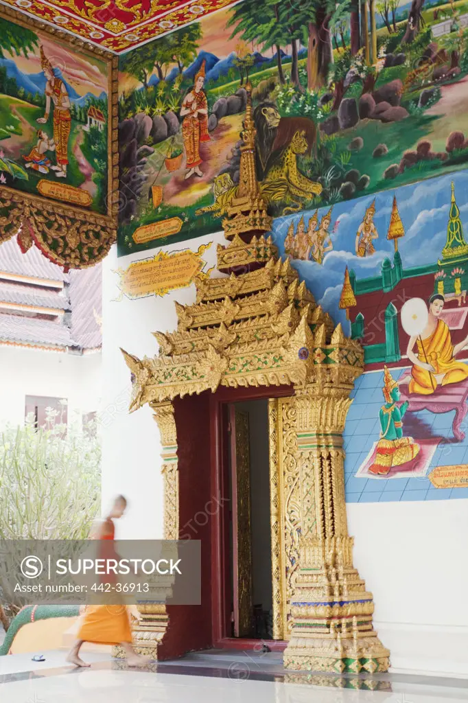 Monk entering main prayer hall, Wat Inpeng, Vientiane, Laos