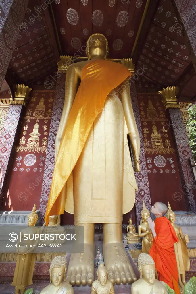 Giant standing Buddha statue in a temple, Wat Sensoukarahm, Luang Phabang, Laos