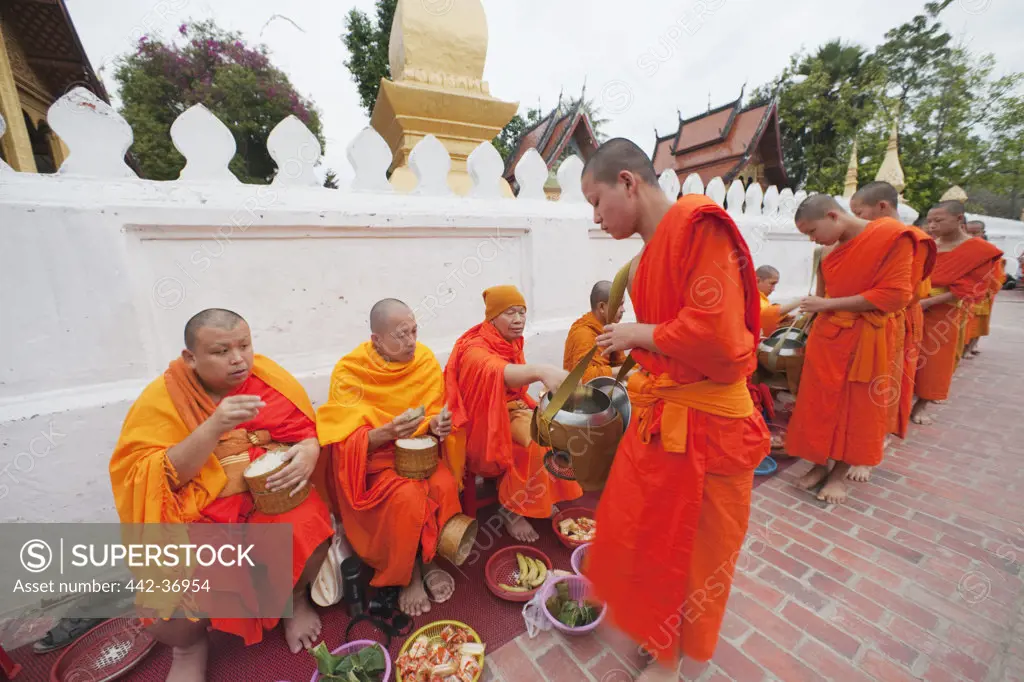 Monks collecting alms, Wat Sensoukarahm, Luang Phabang, Laos